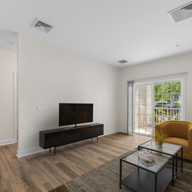 Heritage at Bedford Springs - Spacious Living Room with Balcony View